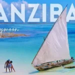 Zanzibar Honeymoon Guide: Top Romantic Spots & Luxury Stays Couple by sailboat on beach